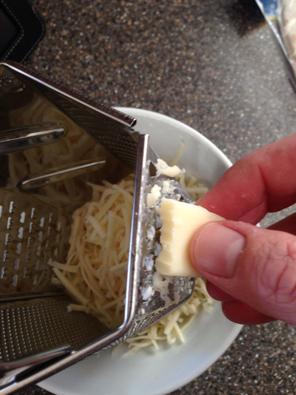 Shred the cheese.. Nibble a bit to make sure it's ok. :-)