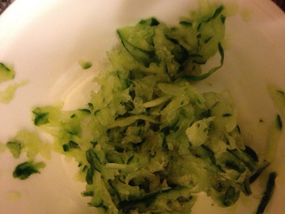 Shred your cucumber and remove all excess water with your hand