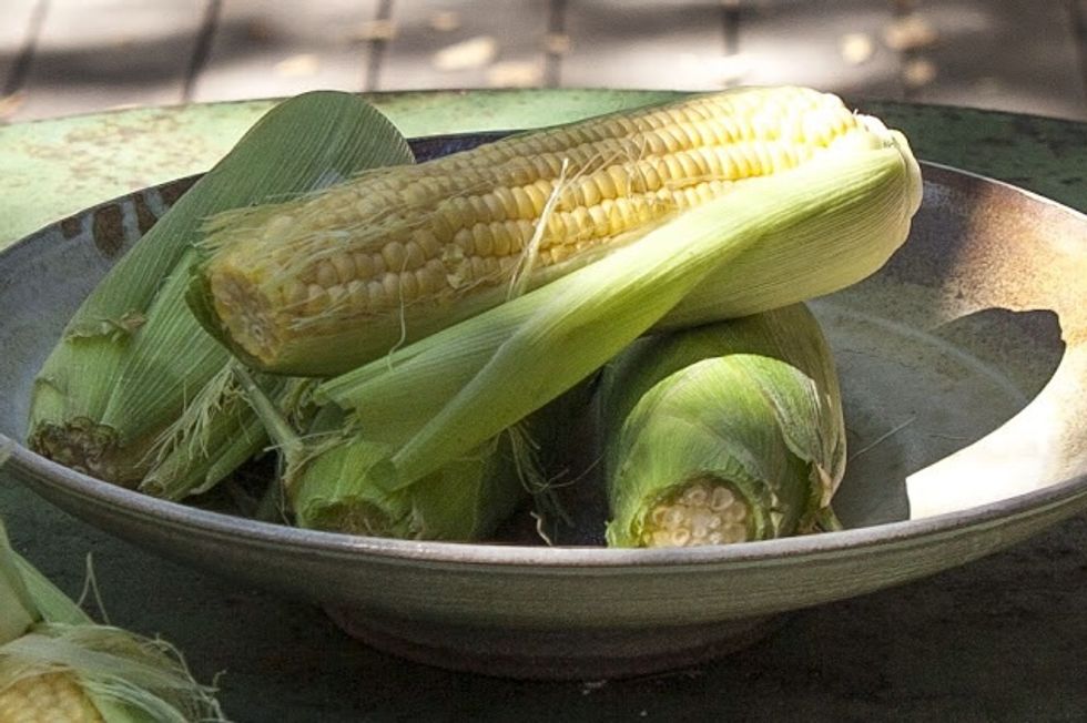 Shuck and clean 6 ears of fresh corn. Scrape the kernels off the cobs.
