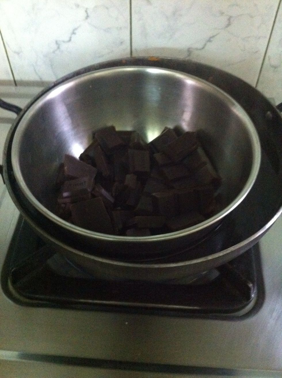 Side by side melt dark chocolate on double boiler. You can add more chocolate in it if you want. The more the better.