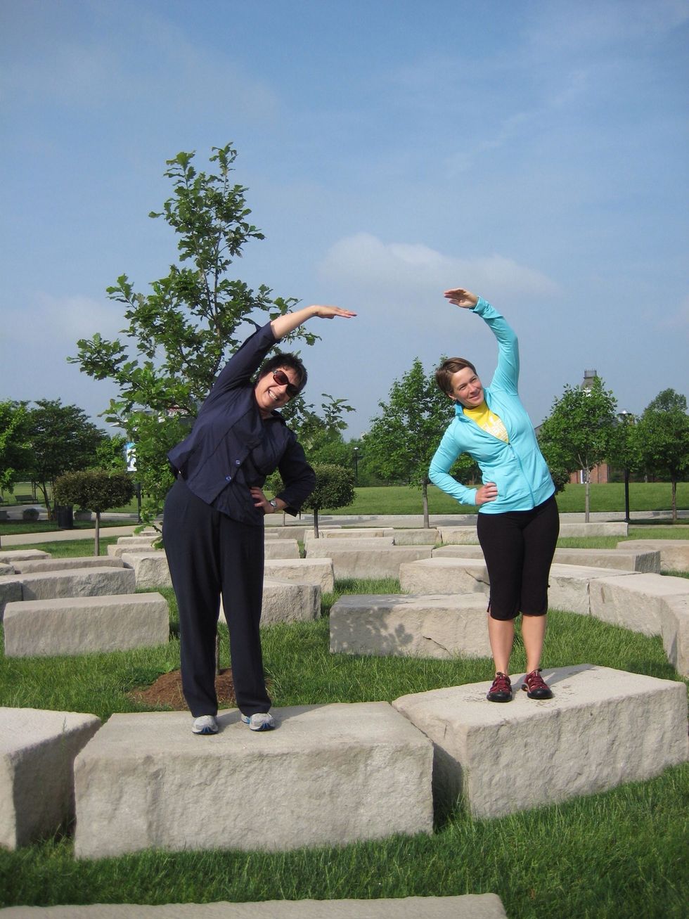 Side lean \u2013 One hand on hip, reach the other hand straight up in the air and lean towards the other hand