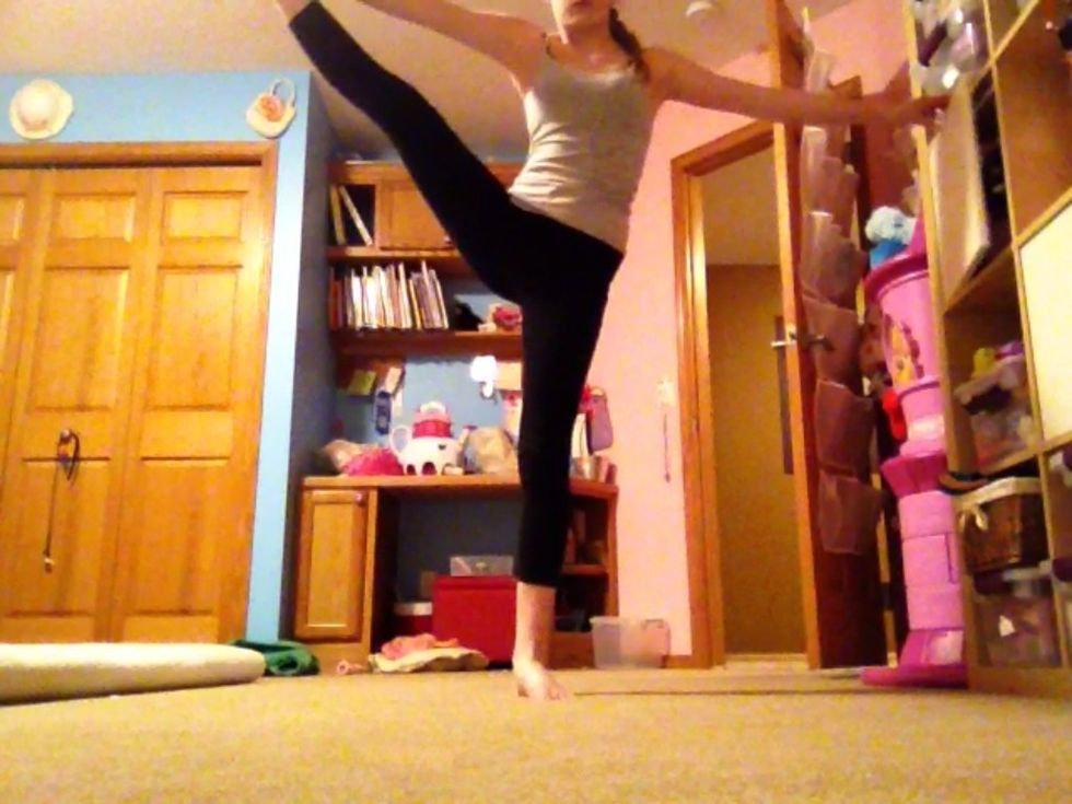 Side leg extension: start standing then grab your ankle and extend your leg to the side