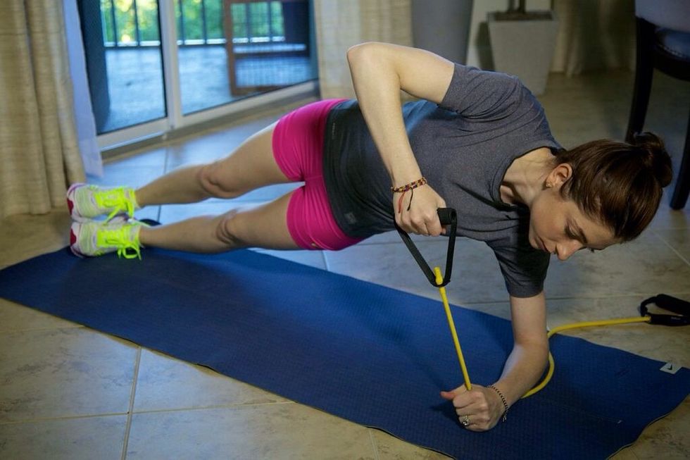 Side Plank Lift Part I: get into side plank position with the forearm resting on the floor. Hold the distance band in each hand so it does not have slack if hands are a few inches apart.