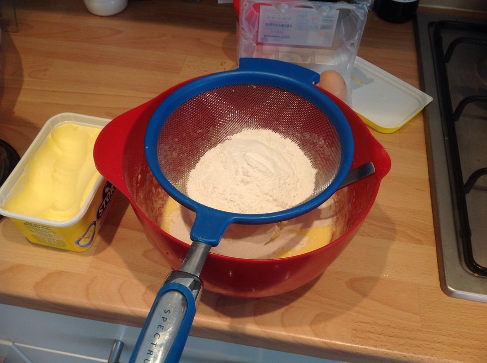 Sieve and fold in 150g flour