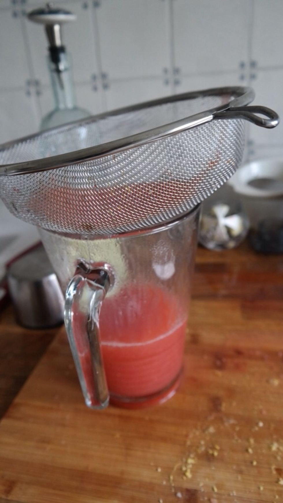 Sieve strawberry puree through a mesh strainer into a large bowl and add to fresh lemon juice.