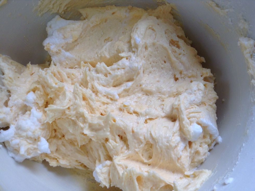 Sift 150gm flour in another bowl. Fold \u2153 egg whites into creamed sugar/butter, then, \u00bd flour, then rest of egg whites, finally remaining flour. Don't over mix. Heat oven to 170\u00b0C.