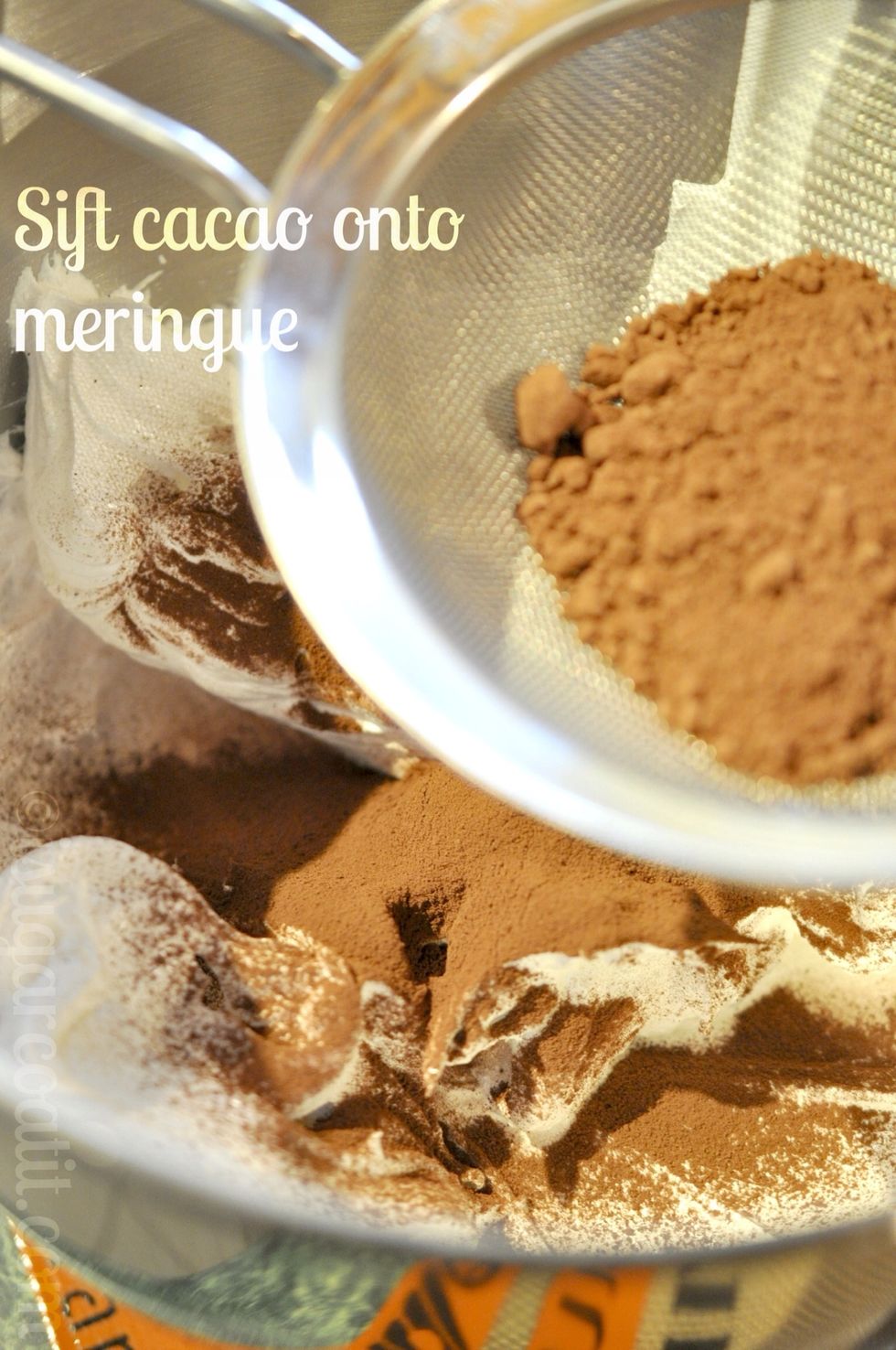 Sift cocoa onto the meringue.
