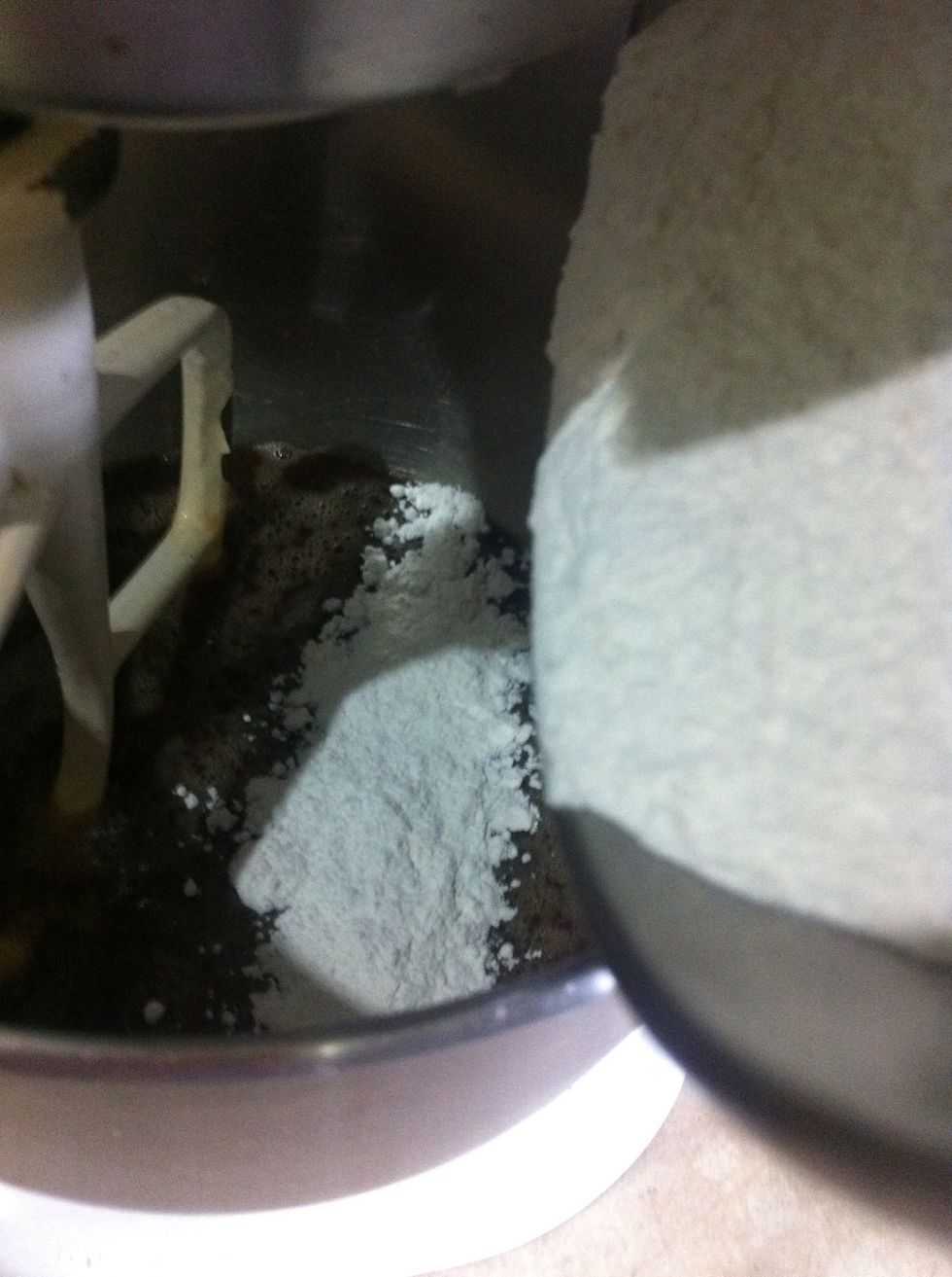 Sift combined flours over chocolate caramel mixture and stir with a wooden spoon until well combined.