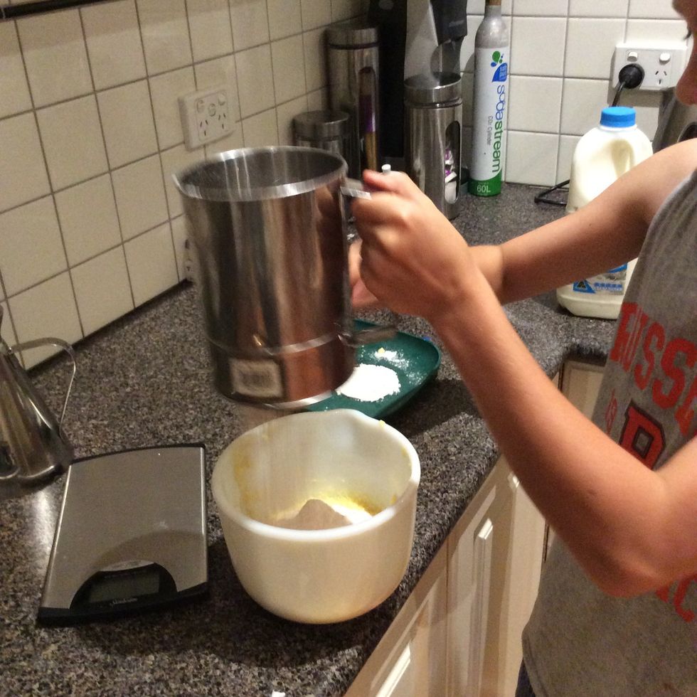 Sift flour,baking powder and cocoa together into the mixture