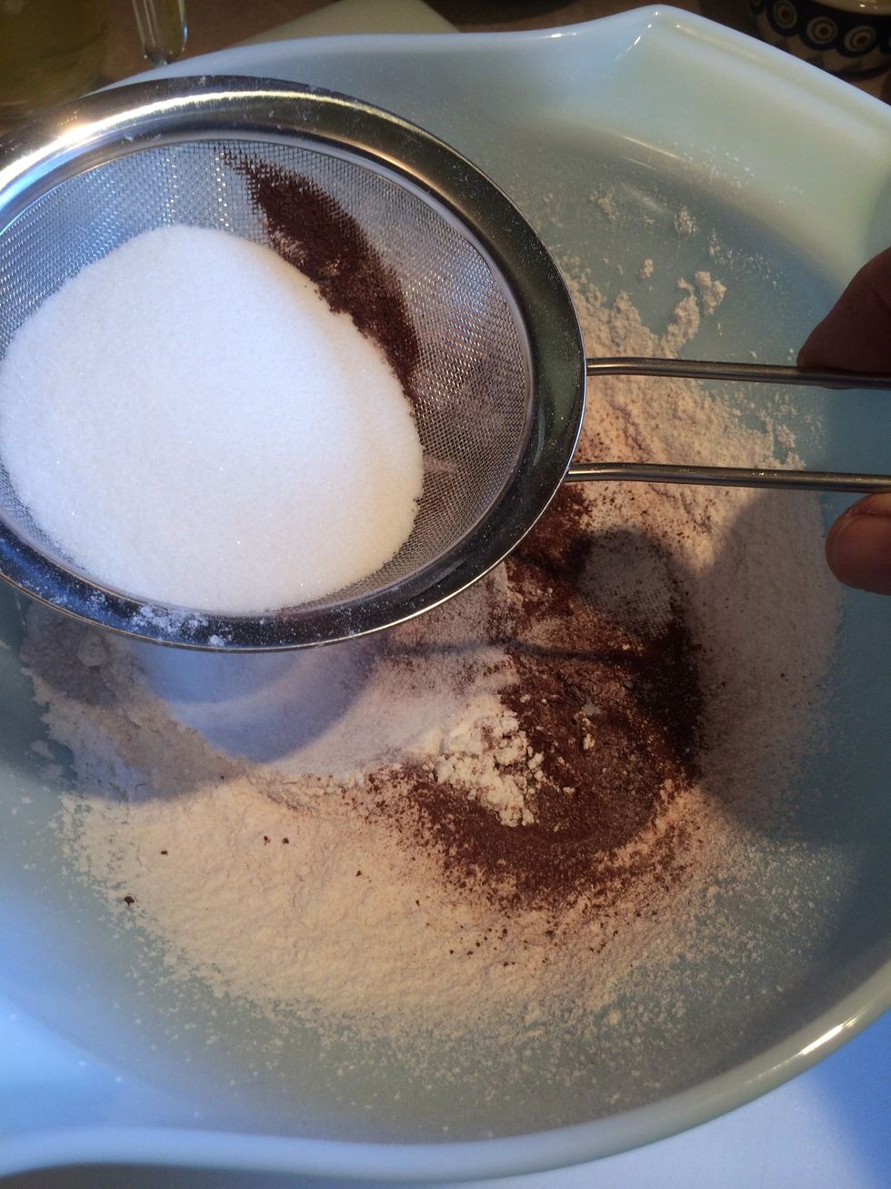 Sift in 1/2 the sugar.