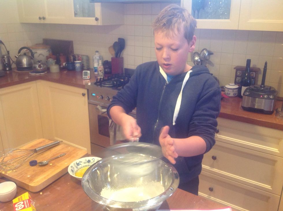 Sift in plain flour and corn flour and combine well