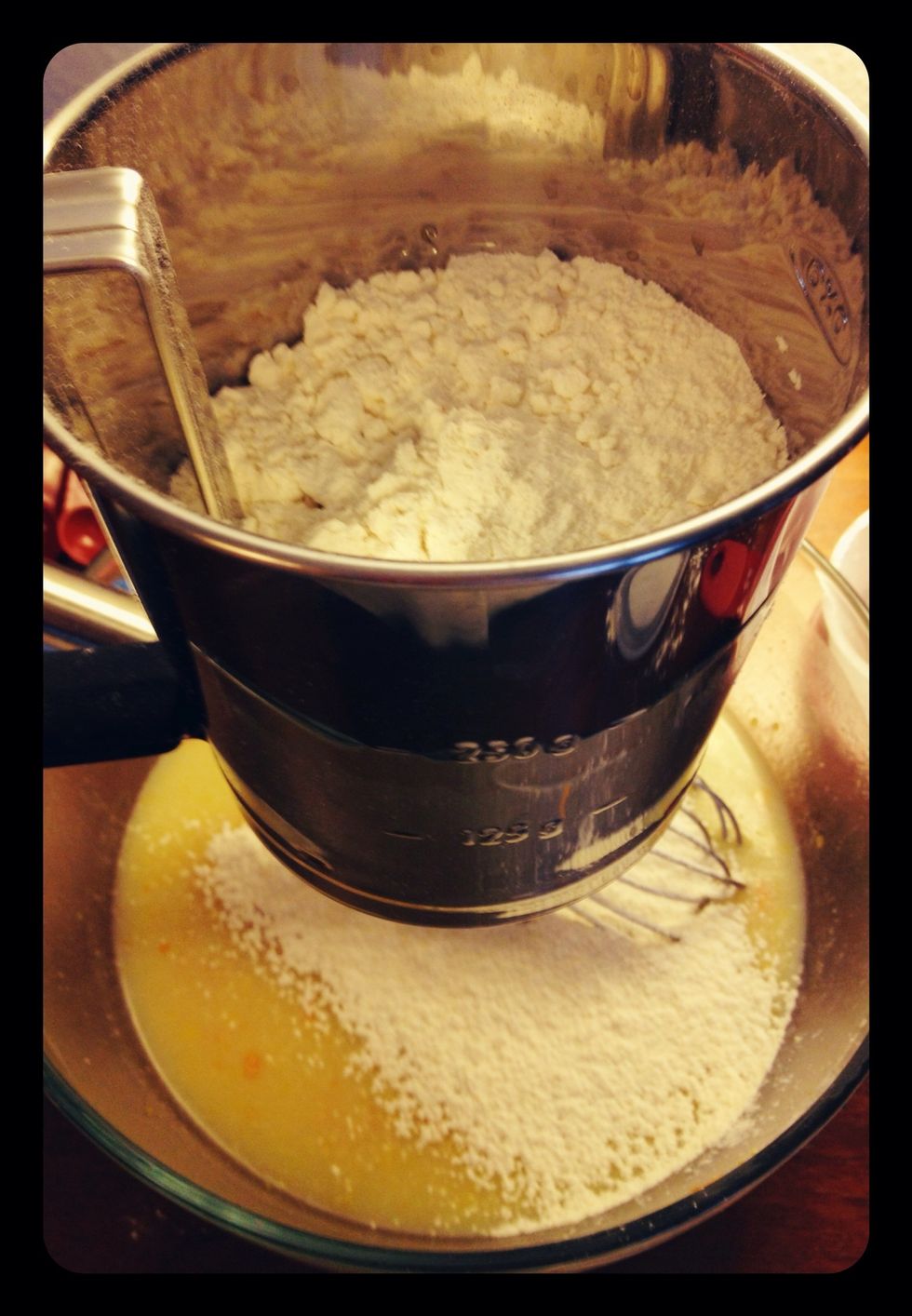 Sift in the flour, baking soda, baking powder, and salt.