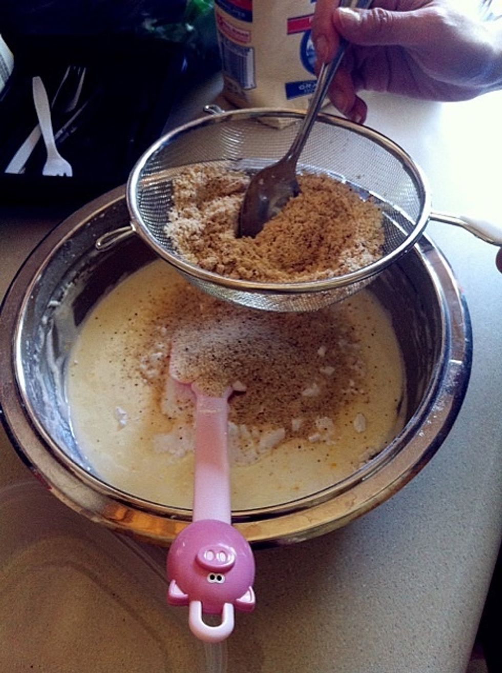 Sift powdered sugar and almond powders together.  P/S: Michelle's piggy spatula is super cute!!