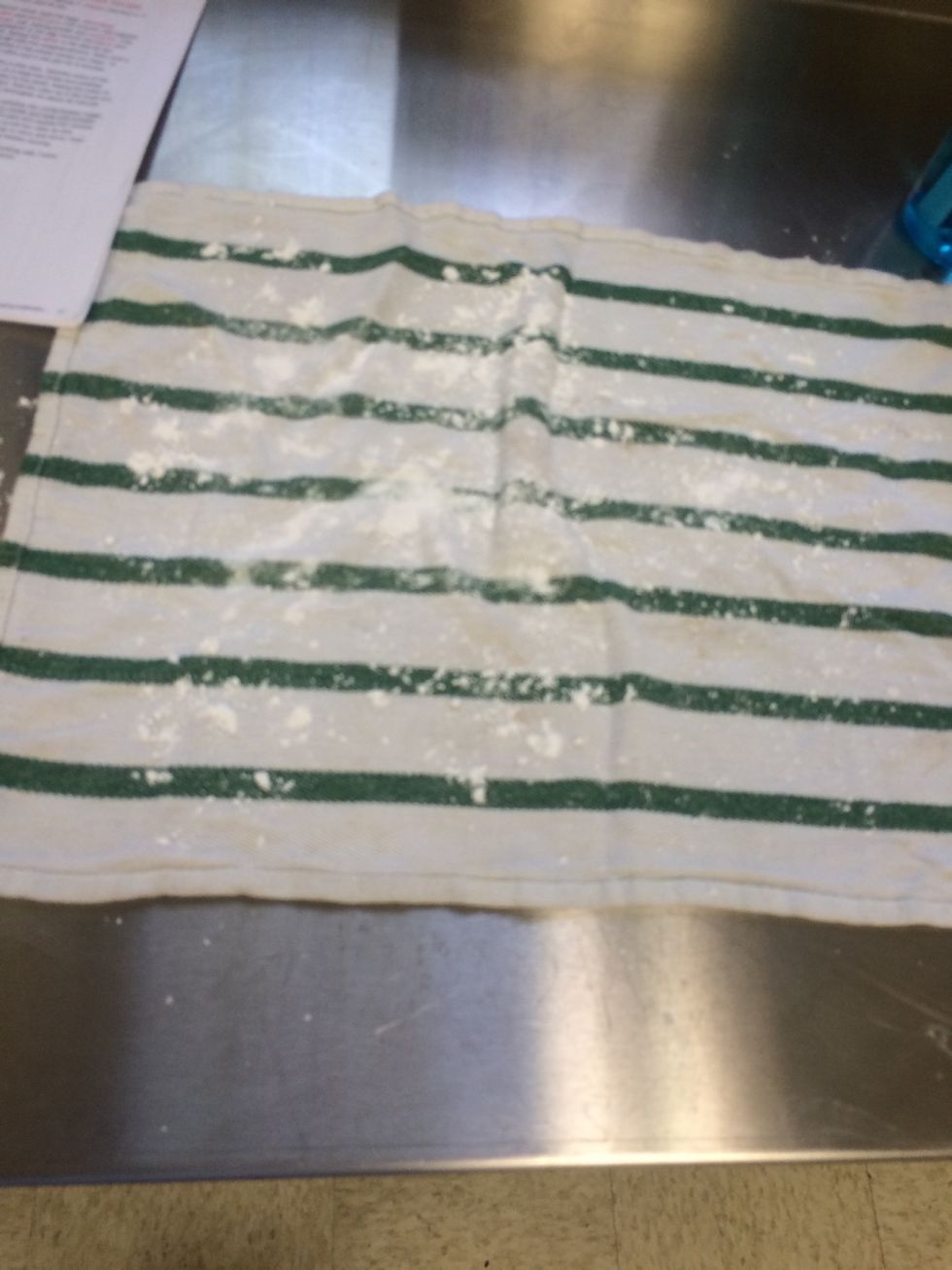 sift powdered sugar into 2 clean towels