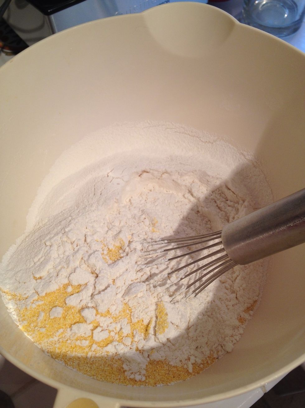 Sift the dry ingredients into the cornmeal.