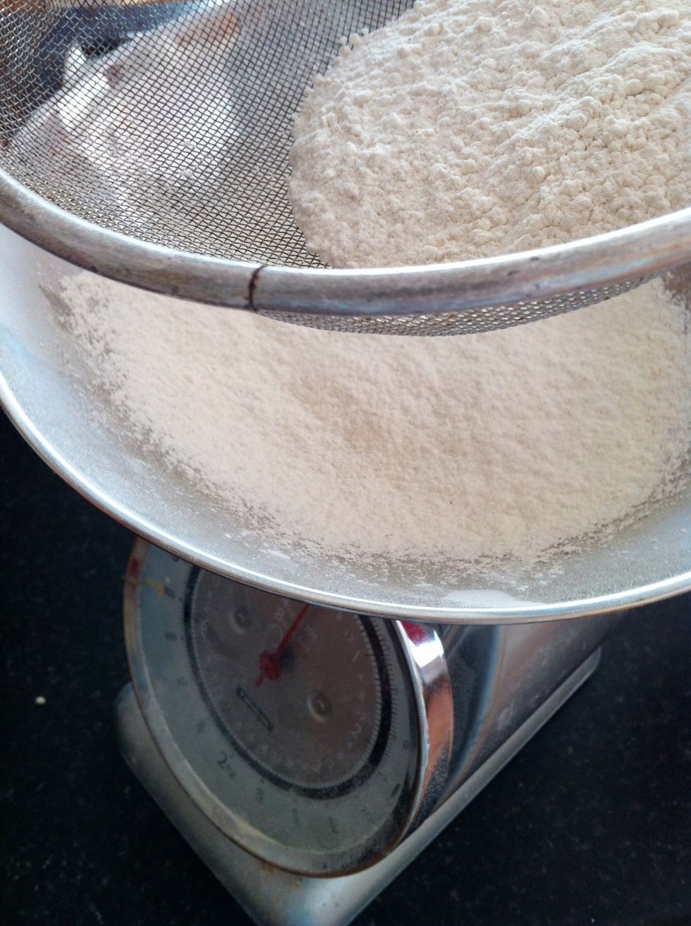 Sift the flour and baking powder together and add the sugar. These are your dry ingredients