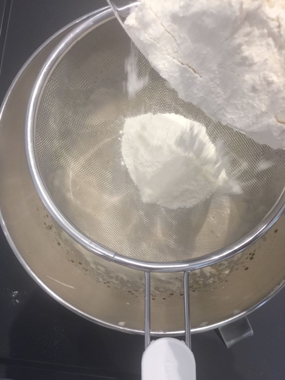 Sift the flour mixture over the egg-sugar-butter mixture