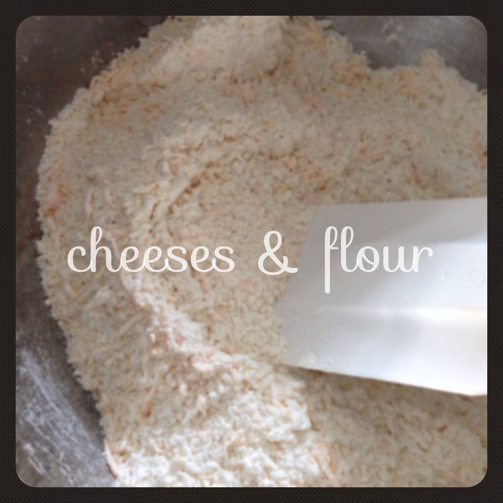 Sift together 1.5 cups of flour, 1 tbsp of baking powder, 1.5 tbsp of sugar and 1 tsp of salt. Then stir in the grated cheese :)