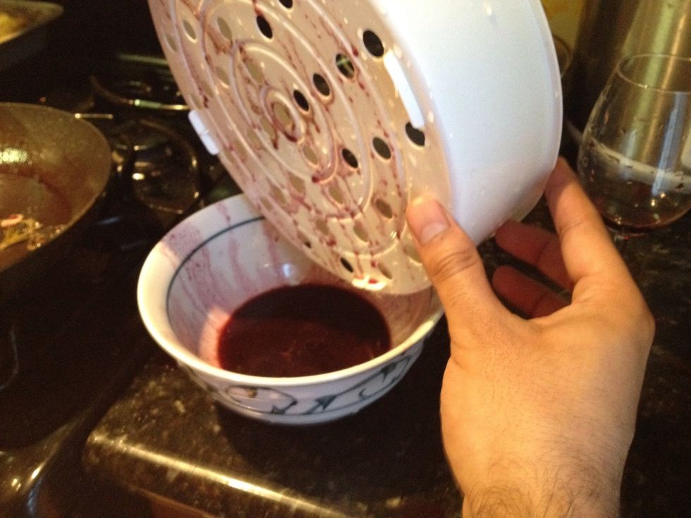 Sift wine sauce to rid the garnishes.