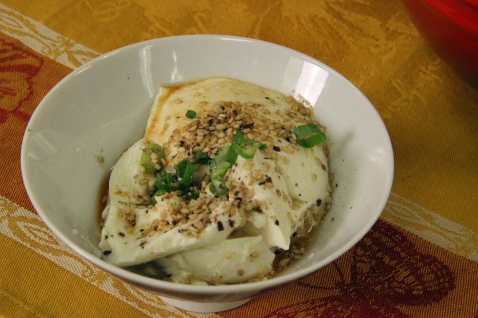 Silken tofu is very soft and delicate. Simply sprinkle with gomasio (a combination of sesame seeds with seasoning), green onions and soy sauce for a delicious snack.
