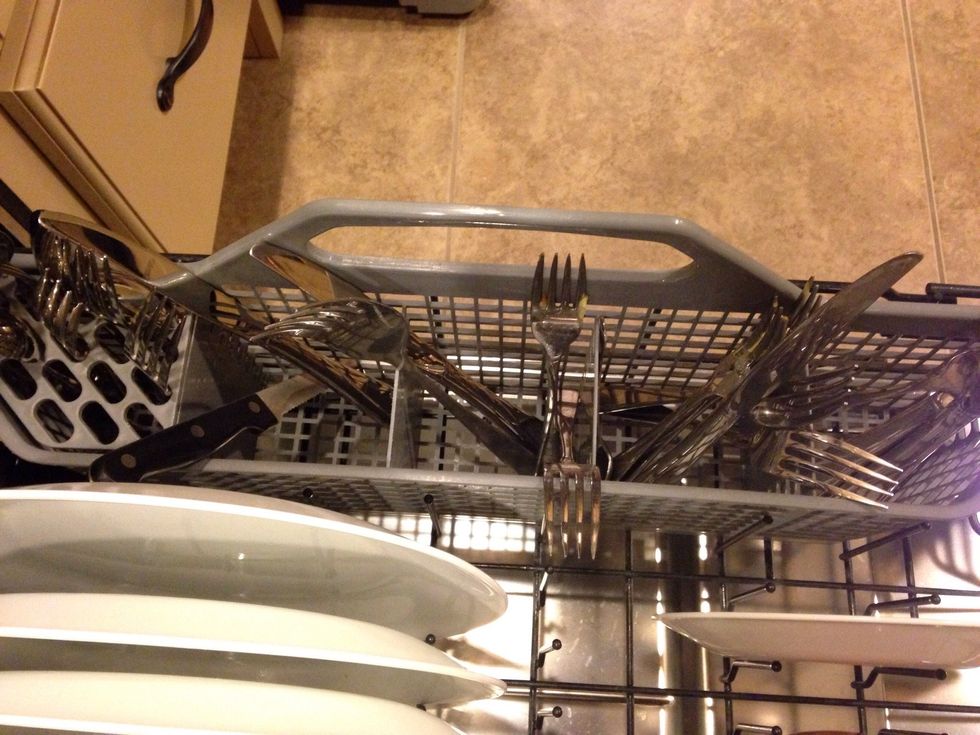 Silverware should be placed in the cutlery basket with the handles down