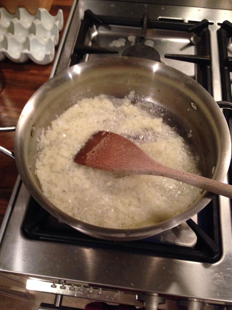 Simmer chopped onions and garlic in olive oil
