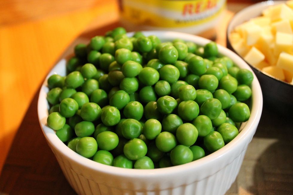 Simmer peas on low in a small amount of water until they become soft. Strain and set aside for salad.
