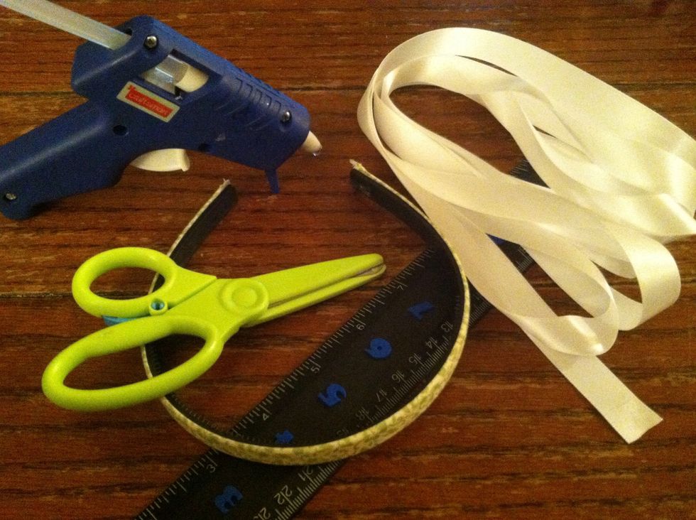 Simple supplies. The width of your headband and your ribbon will decide how long your ribbon must be. This is not a good project for scraps. Here I'm using a 1/2in headband and 1/2in ribbon.
