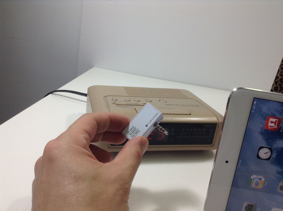 Simply connect the music transmitter for iPhone to your iPad Air or iPad Mini's audio port.
