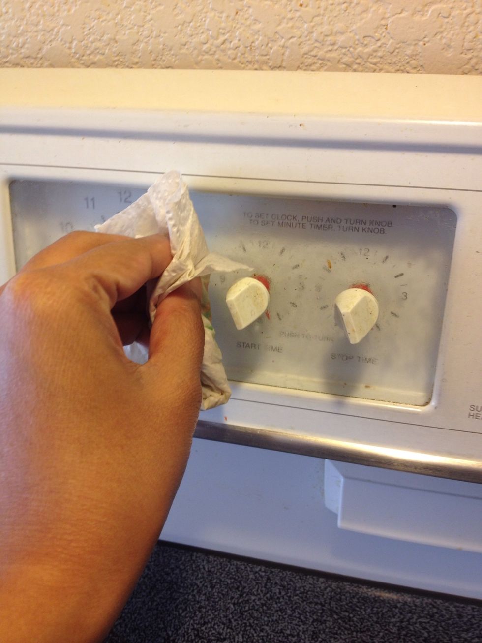 Simply squirt some rubbing alcohol onto your paper towel and scrub away! If there's a lot of sticky stuff you will be scrubbing harder and longer...