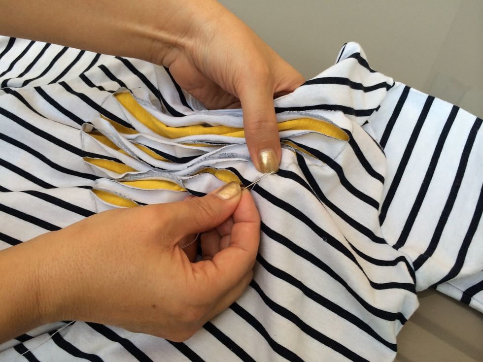 Simply stitch all around the heart shape. It's better to follow the line you drew before on the shirt.