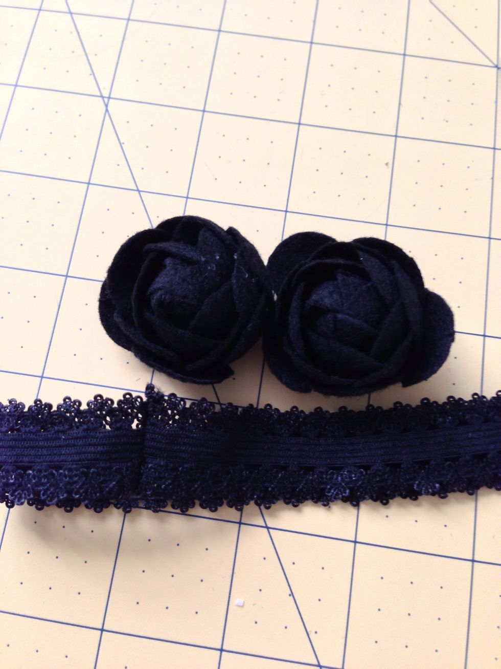 Simply take a couple flowers and hot glue them to your pre-sewn headband.