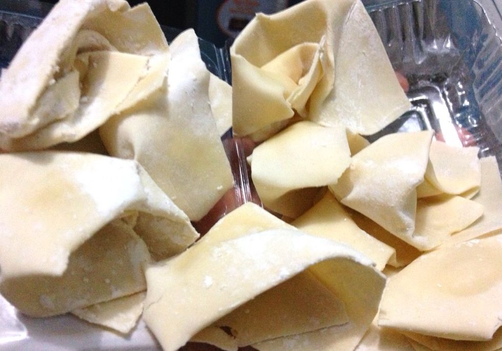 Since I feel so lazy today :) I bought ready made wontons skin,  put a little bit of sauted minced chicken and salt and white pepper, fold it and fry it later ... I prepare 15 wontons