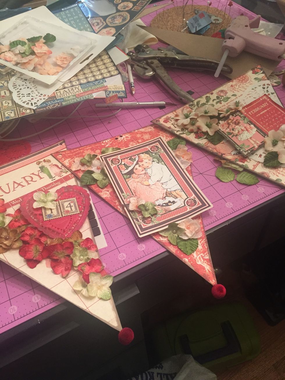 Since I made each pennant different I like to have a additional element to tie them together, so I glued on some velvet beads to the tips. *do this after you string them though- lesson learned!