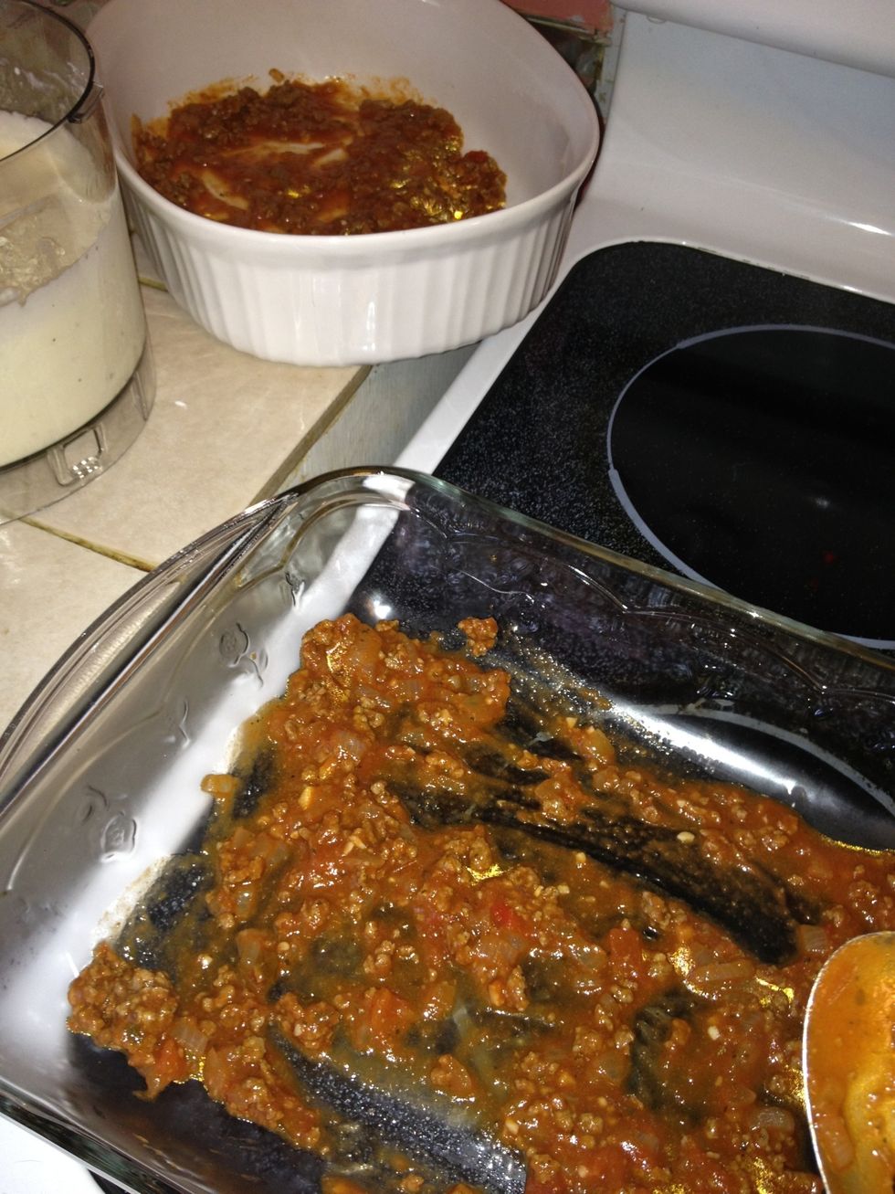Since oven has been preheating from the start at 350 these last few steps will complete your meal...add sauce to bottom of casserole dishes. You might only need one. I cooked enough to fill three;)