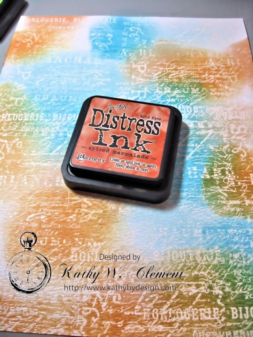 Since Spiced Marmalade is darker than Dried Marigold, I worked that color into the mix next. Look how the emboss/resist is showing through the ink. Isn't it cool?