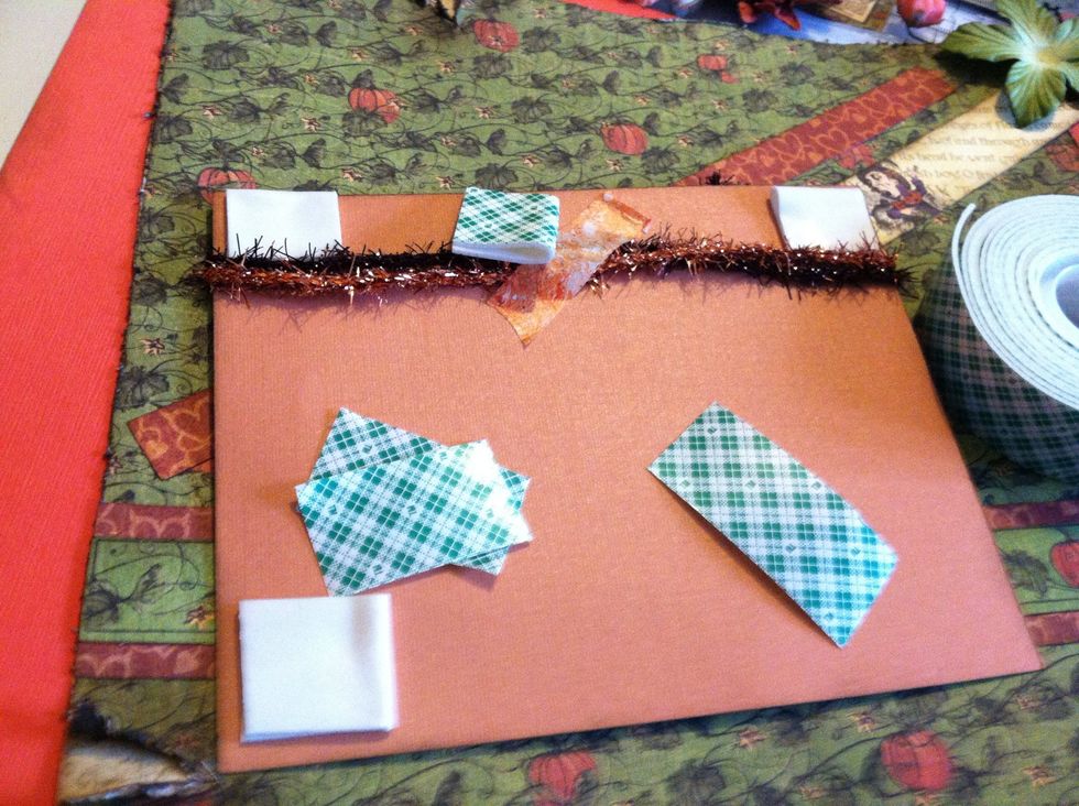 Since the tinsel twine on the back of the photo mat kept it from laying flat, I used foam mounting tape folded in half to lift it up. I actually used 2 layers of this tape to get it to lay right.