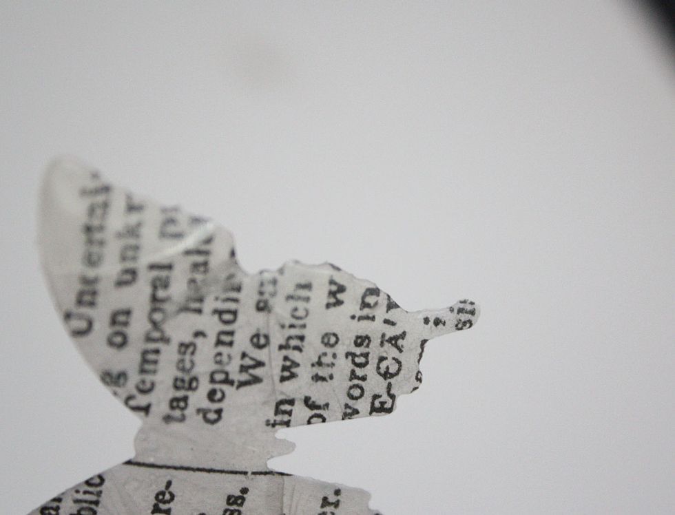 Since the UTEE has harden it should be easy to crack. GENTLY bend the butterfly back and forth to get the cracks.