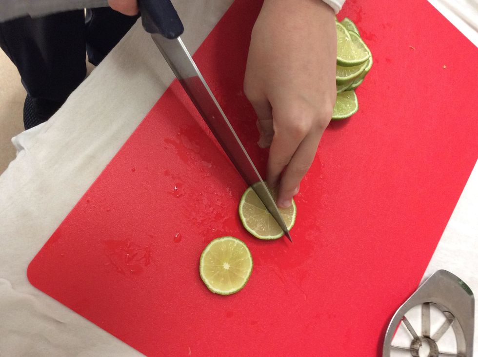 Since you had cut them off to about 1/3", now you just cut the lemon lime in half to make some sort of moon shape. Repeat this step until you have all the half moons from all the lemon limes