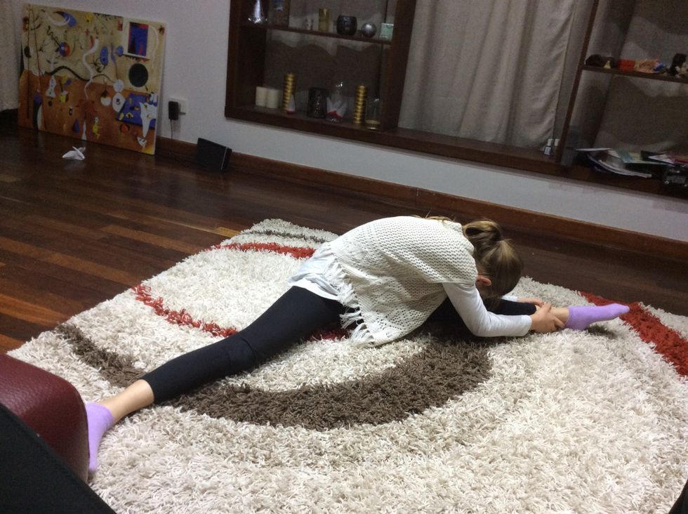 Sit in a straddle and try get your nose to touch you knee and do that to both legs