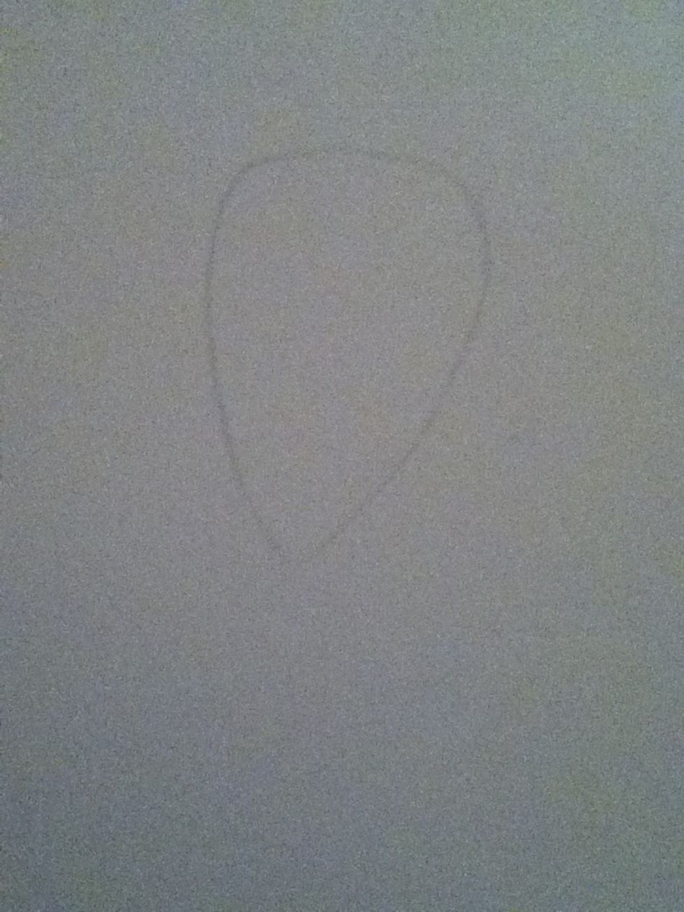 Sketch an egg shape for the head.