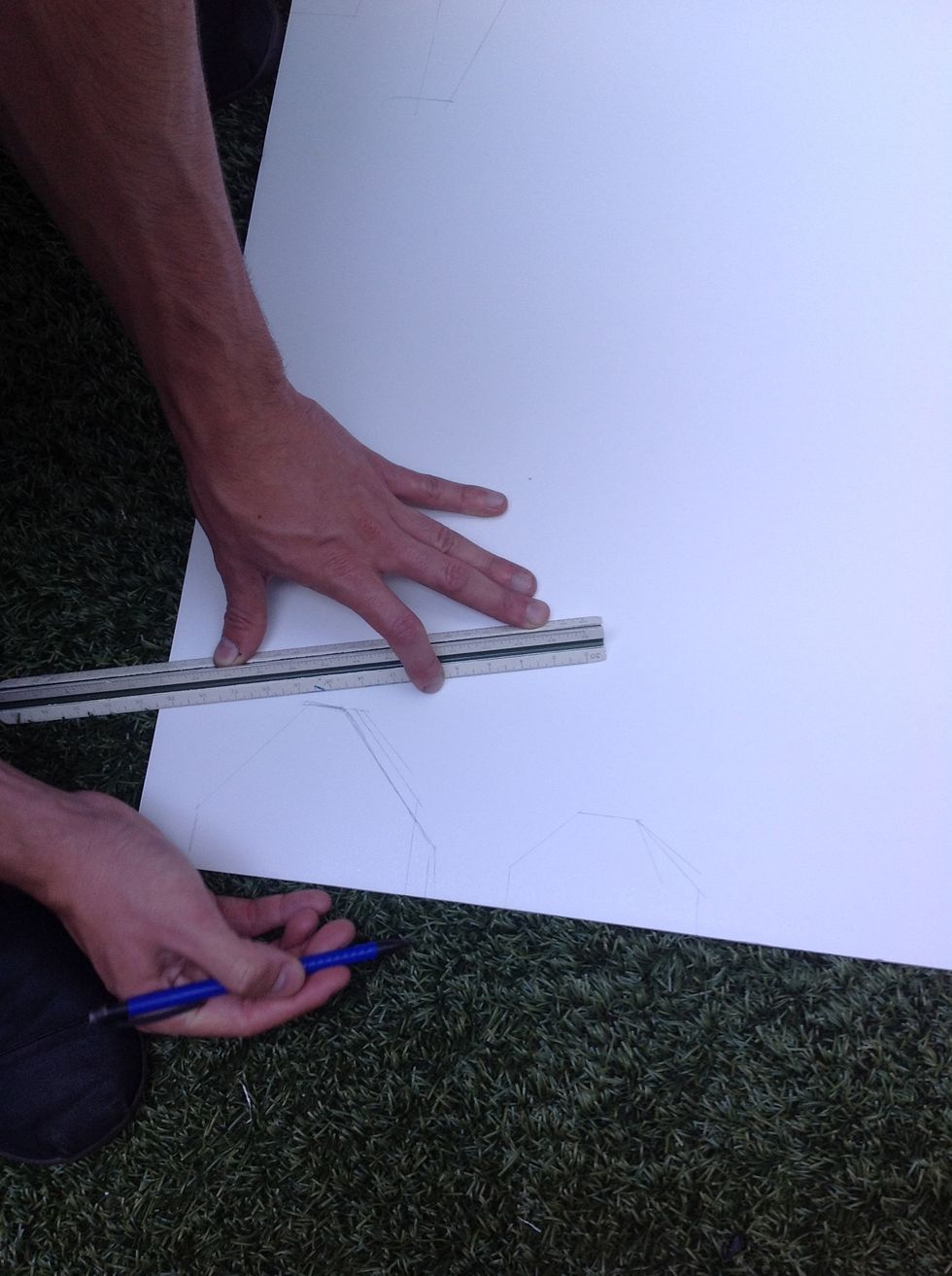 Sketch out the normal and large tail wings on foam board and then cut them out. You may need a box cutter.