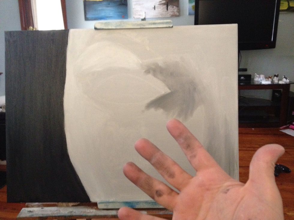Sketch the outline of the head, then fill in the background with black. Once you are done, you can take the remaining black on your fingers and scrub in the hint of shadow around the eye and nose