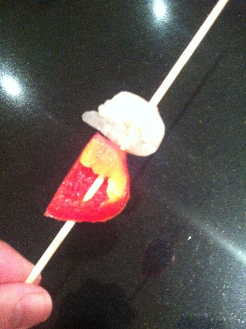 Skewers begin with large slice of red pepper then thread on prawns