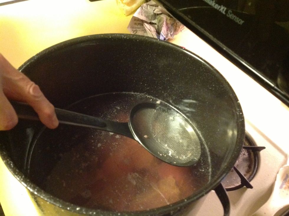 Skim off meat scum until no more scum is produced (about half hour)