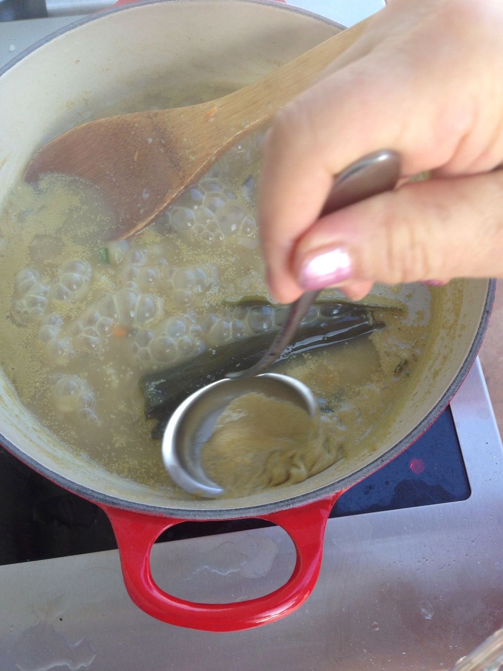 Skim the thin film of froth