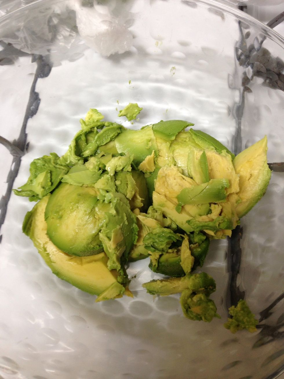 Skin avocados and place in medium mixing bowl