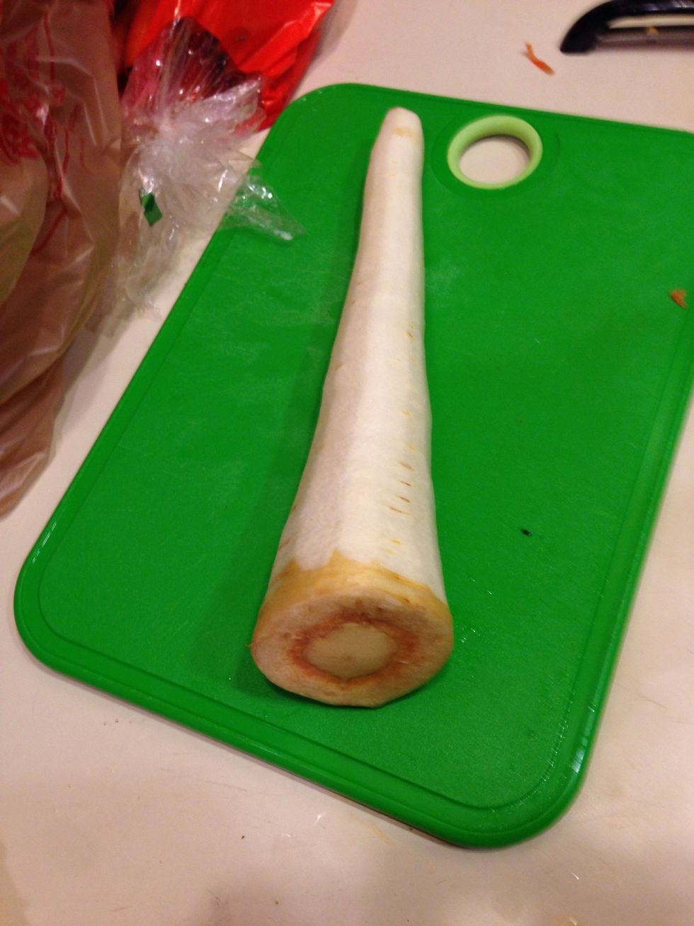 Skin, cut off the ends and cut in half. Then place in the bottom of the stock pot. The vegetables on the bottom of the pit will help keep the chicken from burning.