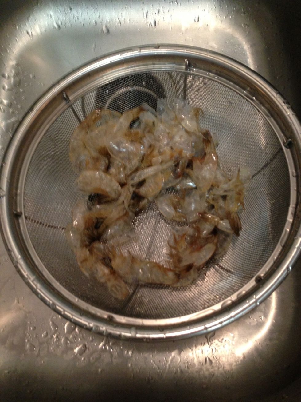 Skins of peeled shrimp. Save for making fish stock or toss in garbage.