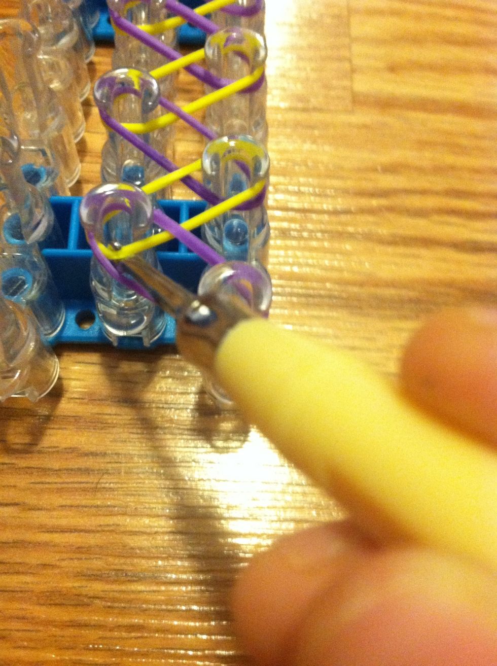 Skip the first band and grab th band and hook it to the right